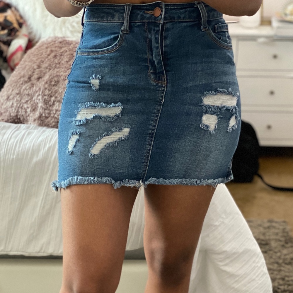 Distressed denim mini skirt
